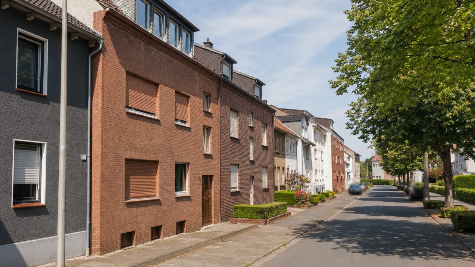 Straßenzug mit Backstein-Mehrfamilienhäusern in Hamm